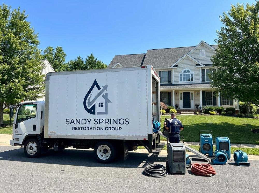 Sandy Springs Restoration Group storm and rain water damage response truck arriving at a Sandy Springs, GA property