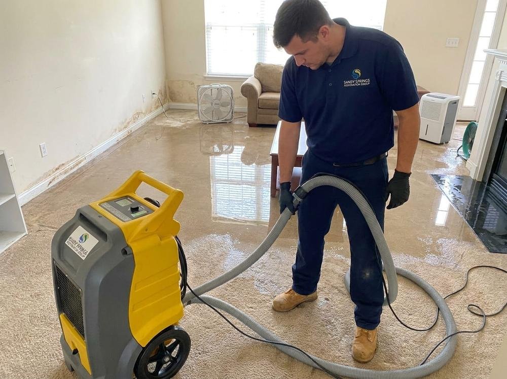 Sandy Springs Restoration Group technician performing water damage restoration and extraction in a Sandy Springs, GA home